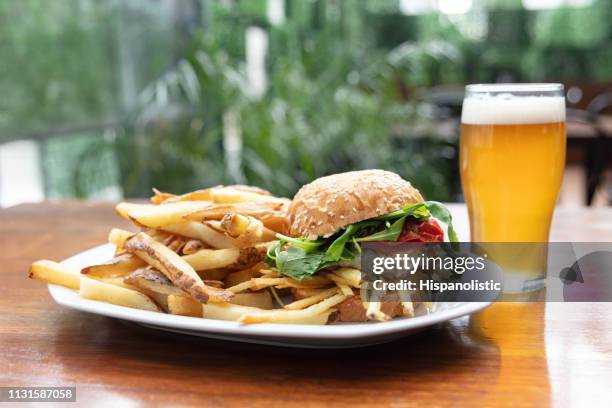 close up of delicious hamburger with french fries and beer - burger close up stock pictures, royalty-free photos & images