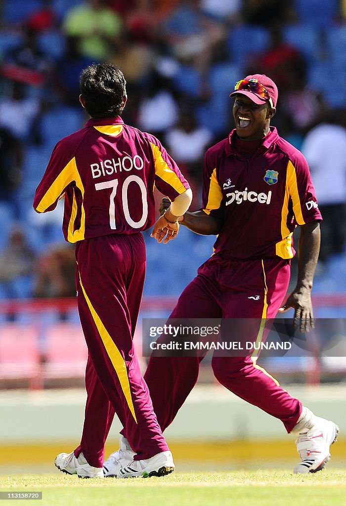 Bishoo West Indies bowler Devendra Bishoo celebrates with captain Darren ...