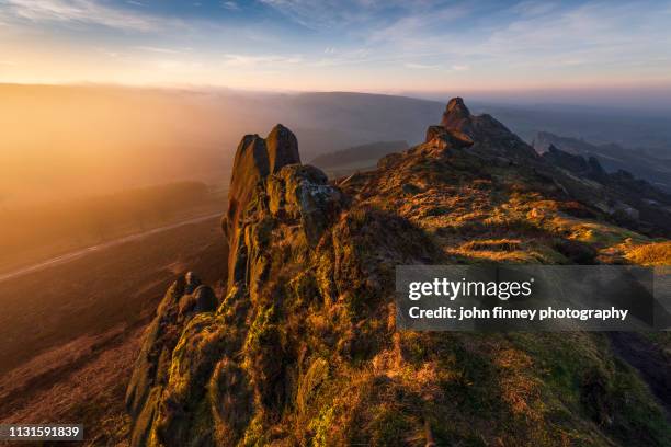 rugged landscape at sunrise, peak district national park. uk. - outcrop stock pictures, royalty-free photos & images