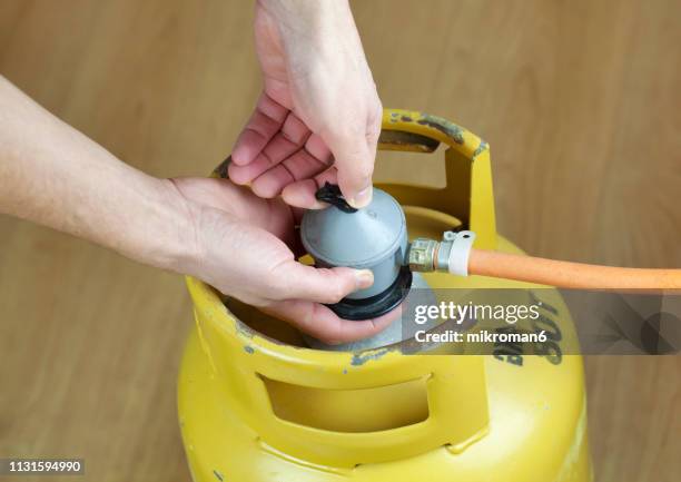lpg gas bottle, butane gas cylinders - lpg-installation stock pictures, royalty-free photos & images