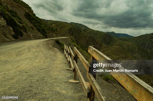 a road across the mointains - paisaje escénico stock pictures, royalty-free photos & images