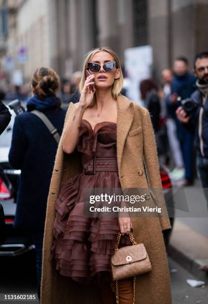 Tatiana Catic wearing beige coat, dress attends Ermanno Scervino show at Milan Fashion Week Autumn/Winter 2019/20 on February 23, 2019 in Milan,...