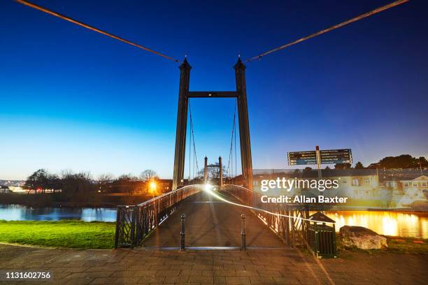 the river exe and the historic cricklepit bridge at dusk - exeter devon stock pictures, royalty-free photos & images