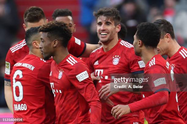 Javi Martinez of FC Bayern Muenchen celebrates his first goal with teammates during the Bundesliga match between FC Bayern Muenchen and Hertha BSC at...