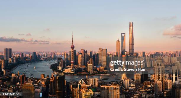 dramatic view of lujiazui in shanghai at dusk - shanghai world financial center stock pictures, royalty-free photos & images