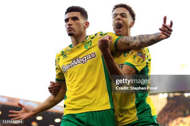 Ben Godfrey of Norwich City celebrates scoring to level the game 2-2 with team mate Jamal Lewis during the Sky Bet Championship match between Norwich...