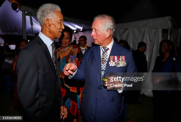 Prince Charles, Prince of Wales speaks with West Indies' cricket legend Garfield Sobers during a reception at the Prime Minister's residence during...