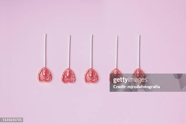 amorous lollipops - niñez stockfoto's en -beelden