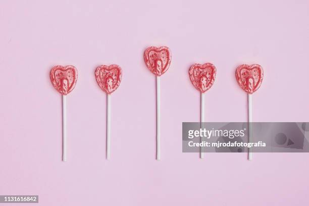 amorous lollipops - niñez stock-fotos und bilder