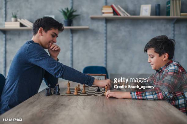 two boys playing chess - chess timer stock pictures, royalty-free photos & images