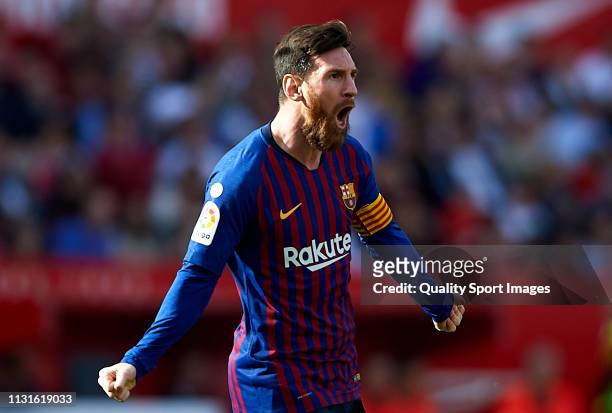Lionel Messi of Barcelona celebrates after scoring his team's first goal during the La Liga match between Sevilla FC and FC Barcelona at Estadio...