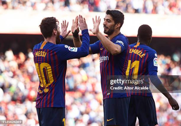 Luis Suarez of FC Barcelona celebrates with his teammates Lionel Messi of FC Barcelona after scoring his team's fourth goal during the La Liga match...