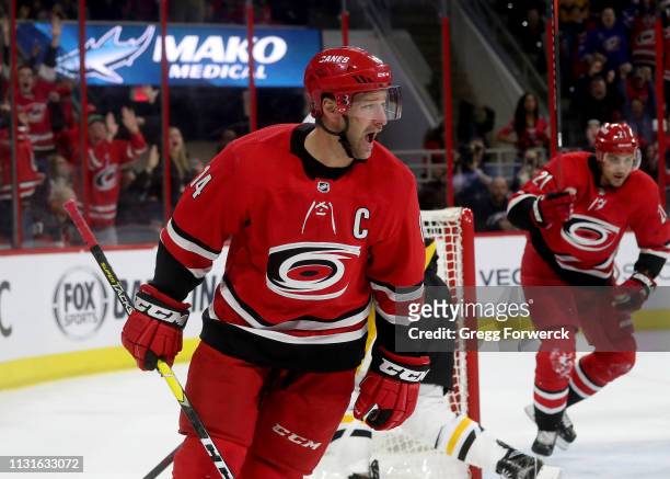 Justin Williams of the Carolina Hurricanes scores the game tying goal in regulation during an NHL game against the Pittsburgh Penguins on March 19,...