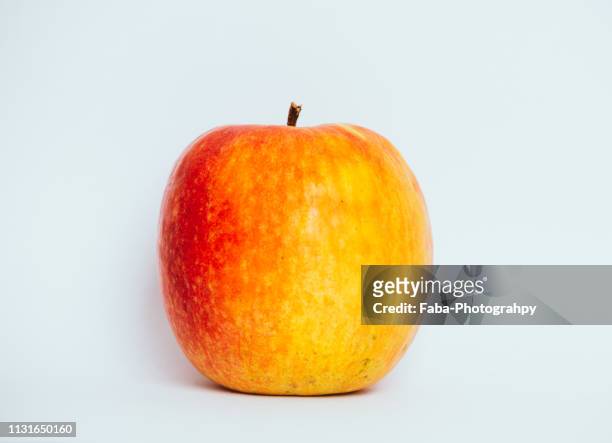 red orange apple - speisen und getränke stock pictures, royalty-free photos & images