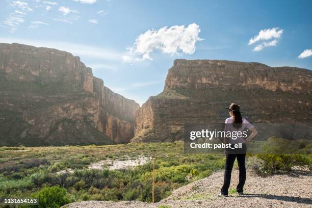 woman wearing hat santa elena canyon big bend - big bend national park stock pictures, royalty-free photos & images