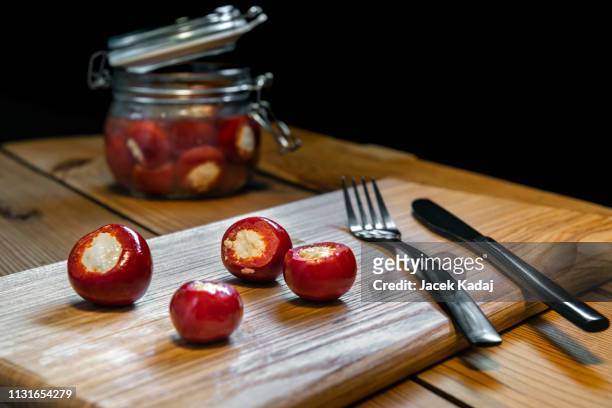 small red peppers - filling jar stock pictures, royalty-free photos & images