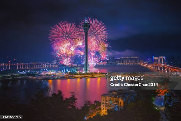 macau skyline with fireworks - macao fotografías e imágenes de stock