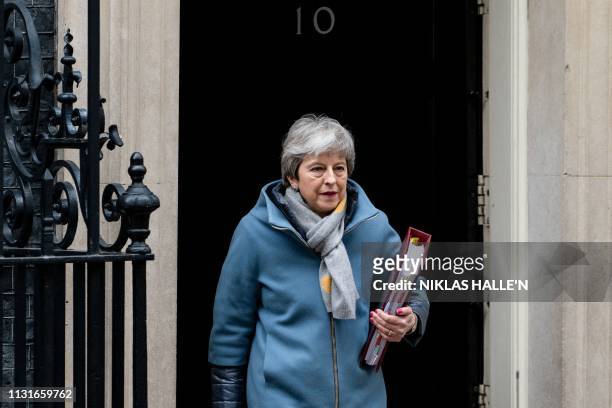 Britain's Prime Minister Theresa May leaves 10 Downing Street in London on March 20, 2019 ahead of the weekly Prime Minister's Questions question and...