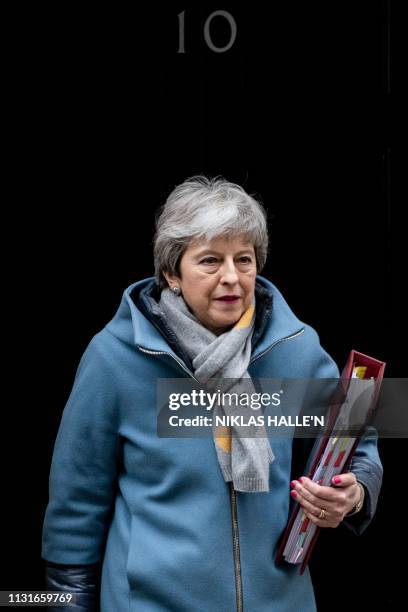 Britain's Prime Minister Theresa May leaves 10 Downing Street in London on March 20, 2019 ahead of the weekly Prime Minister's Questions question and...