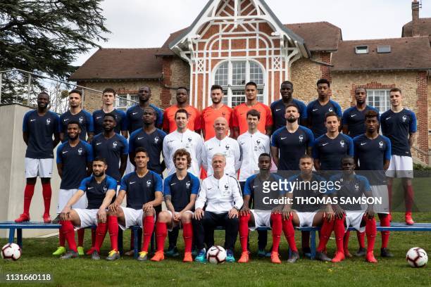 France's national team football players pose for a group photo at the teams' training ground in Clairefontaine-en-Yvelines, southwest of Paris, on...