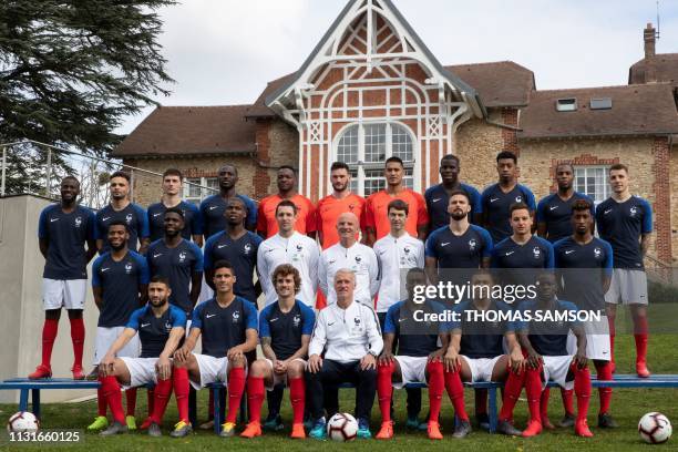 France's national team football players pose for a group photo at the teams' training ground in Clairefontaine-en-Yvelines, southwest of Paris, on...