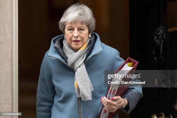 British Prime Minister Theresa May leaves 10 Downing Street to head for the weekly Prime Ministers Questions in the House of Commons on March 20,...