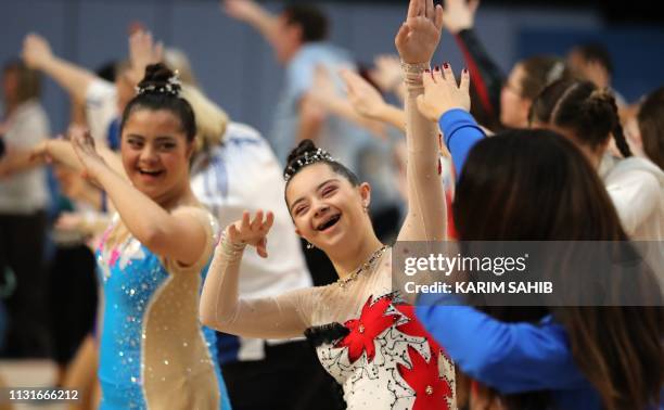 Competitors in rhythmic gymnastics dance during the Special Olympics World Games in Abu Dhabi, United Arab Emirates, on March 20, 2019.