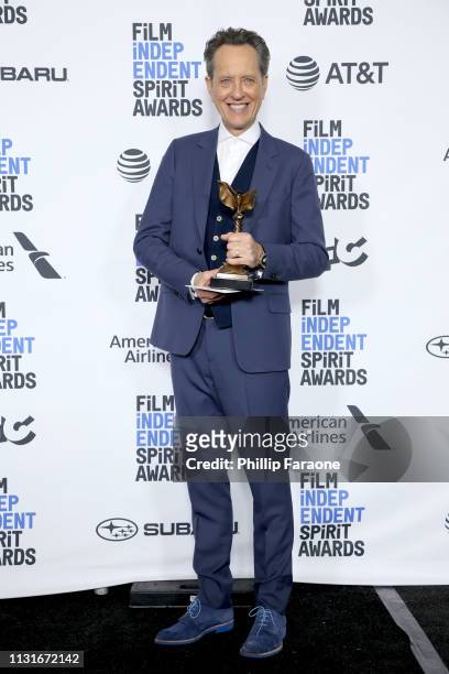 Richard E. Grant poses in the press room with the Best Supporting Male award for the film “Can You Ever Forgive Me?” during the 2019 Film Independent...