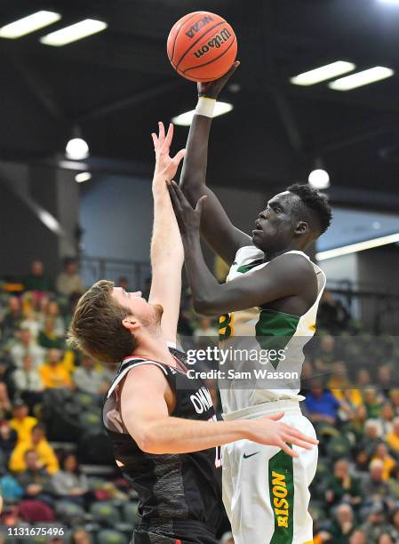 Deng Geu of the North Dakota State Bison shoots against Brett Barney of the Omaha Mavericks during their game at Scheels Center on February 23, 2019...