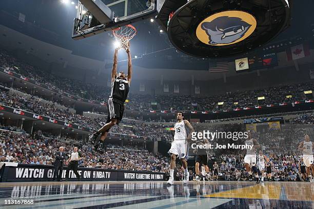 George Hill of the San Antonio Spurs dunks against the Memphis Grizzlies in Game Four of the Western Conference Quarterfinals in the 2011 NBA...