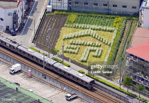 In this aerial image, the accident site of 2005 train derailment which killed 107 people, is seen on April 24, 2011 in Amagasaki, Hyogo, Japan. Three...