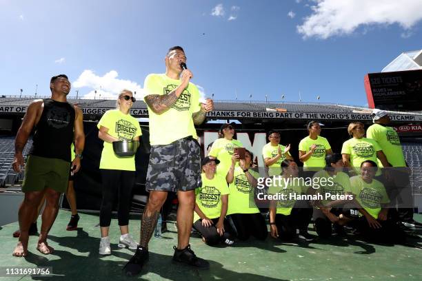 Former All Black Keven Mealamu and Dave Letele of BBM hand out prizes after taking part in the World's Biggest Bootcamp on Eden Park on February 24,...