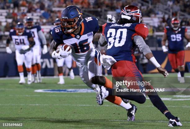 Rannell Hall of the Orlando Apollos runs the ball against Channing Stribling of the Memphis Express in the first quarter during the Alliance of...