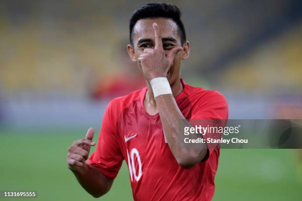 Muhammad Faris Ramli of Singapore celebrates after scoring their 1st goal during the Airmarine Cup match between Malaysia and Singapore at Bukit...