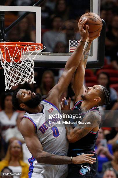 Andre Drummond of the Detroit Pistons blocks a shot by Rodney McGruder of the Miami Heat during the first half at American Airlines Arena on February...