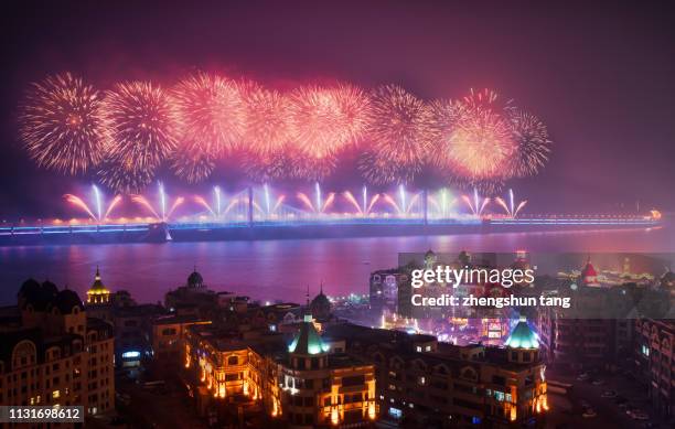 fireworks with city night views. - china city fireworks stock pictures, royalty-free photos & images
