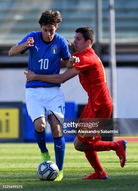 Nicolò Fagioli of Italy U19 competes for the ball with Simon Paulet of Belgium U19 during the UEFA Elite Round match between Italy U19 and Belgium...