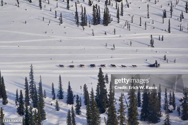 47th Iditarod Race: Aerial view of musher team approaching Rainy Pass. Rainy Pass, AK 3/4/2019 CREDIT: Erick W. Rasco