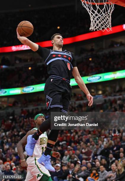 Zach LaVine of the Chicago Bulls goes up for a dunk over Terry Rozier of the Boston Celtics at the United Center on February 23, 2019 in Chicago,...