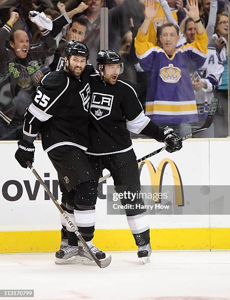 Dustin Penner and Justin Williams of the Los Angeles Kings celebrate after a goal by Williams against the San Jose Sharks in the second period of...