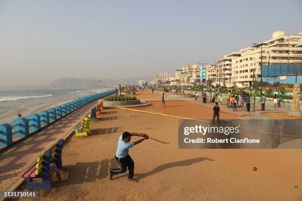 Locals play cricket on Varun beach ahead of game one in the T20I Series between India and Australia on February 24, 2019 in Visakhapatnam, India.