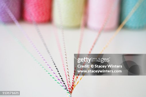 Different colored twine twisting together Different colored twine twisting together