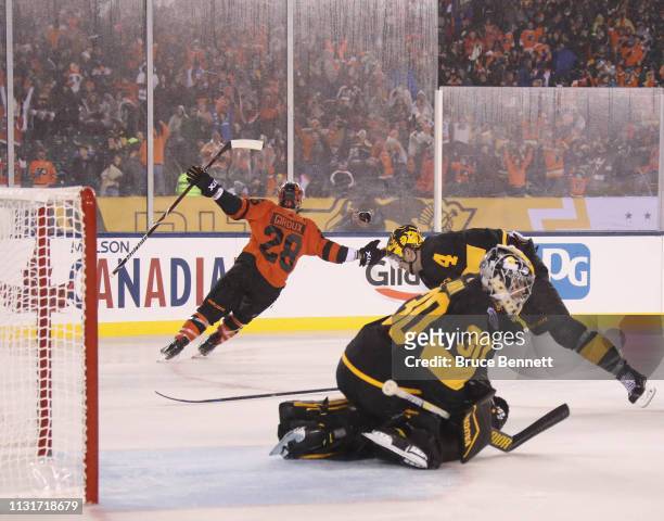 Claude Giroux of the Philadelphia Flyers scores the game winning goal at 1:59 of overtime against the Pittsburgh Penguins during the 2019 Coors Light...