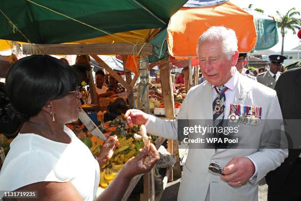 Prince Charles, Prince of Wales is shown some ginger as he visits Kingstown Market during a visit to St. Vincent and the Grenadines on March 20, 2019...