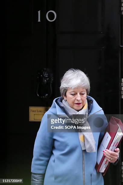 British Prime Minister Theresa May is seen departing from Number 10 Downing Street to attend the Prime Minister's Questions in the House of Commons.