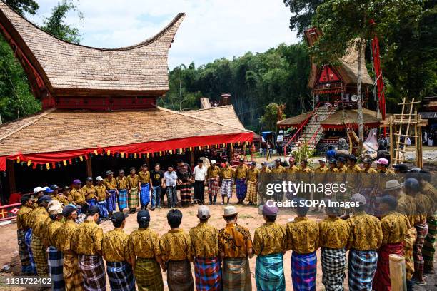Residents are seen performing the ma'badong dance during the Rambu Solo ritual in Tana Toraja District, South Sulawesi. Rambu Solo is a funeral...