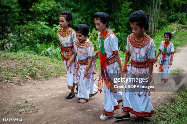 Residents wearing traditional clothes are seen during the event in Tana Toraja District, South Sulawesi Rambu Solo is a funeral procession for the...