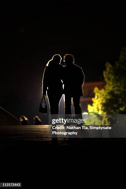 romantic couple walking in dark - cambridge bridge stock pictures, royalty-free photos & images