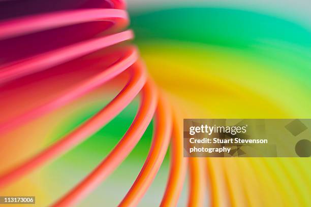 slinky toy - metal coil toy stock-fotos und bilder