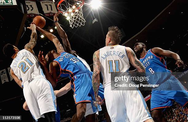 Kevin Durant of the Oklahoma City Thunder and Wilson Chandler of the Denver Nuggets battle for a rebound as Chris Andersen of the Denver Nuggets and...